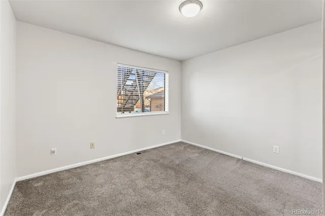 a view of a balcony with wooden floor