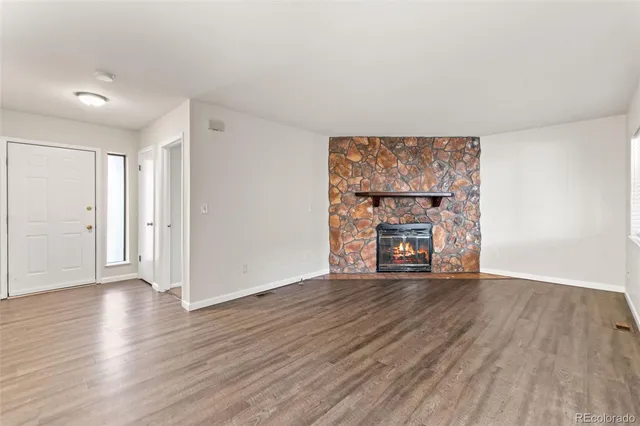 a view of kitchen with wooden floor and windows