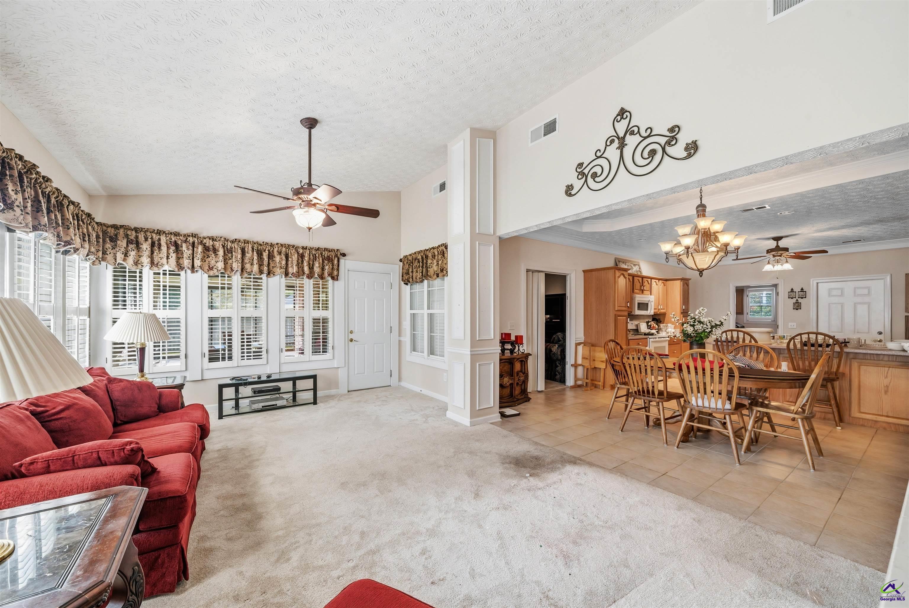 206 North Hampton Place Perry, GA 31069 - Photo 16 of 20 a view of a dining room with furniture window and outside view