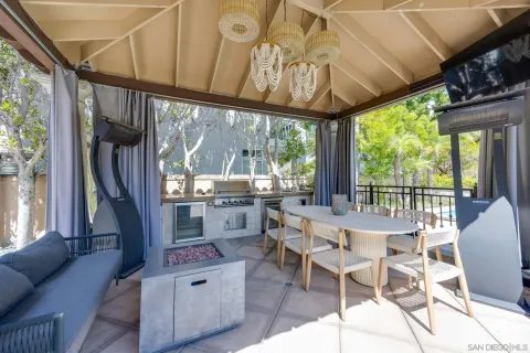 a dining room with furniture water view and balcony