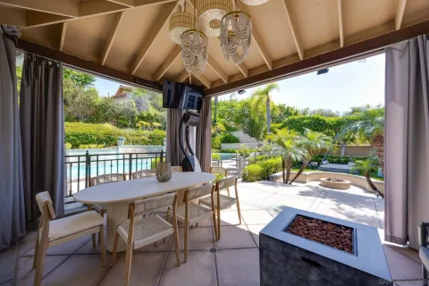 a outdoor space with a table and chairs