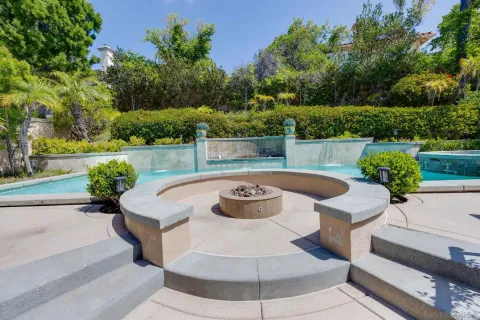 a view of a swimming pool with lounge chair