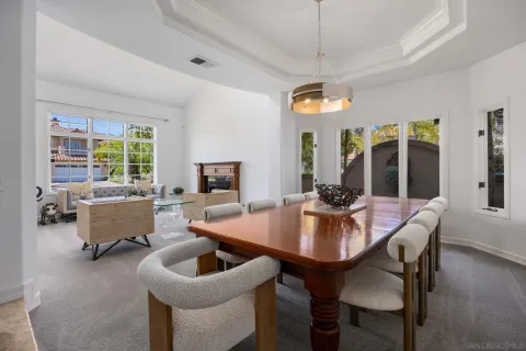 a view of a dining room with furniture window and outside view