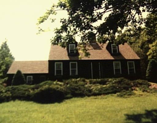 26 Jack Corner Road Warren, CT 06777 - Photo 1 of 1 a front view of house with yard and trees