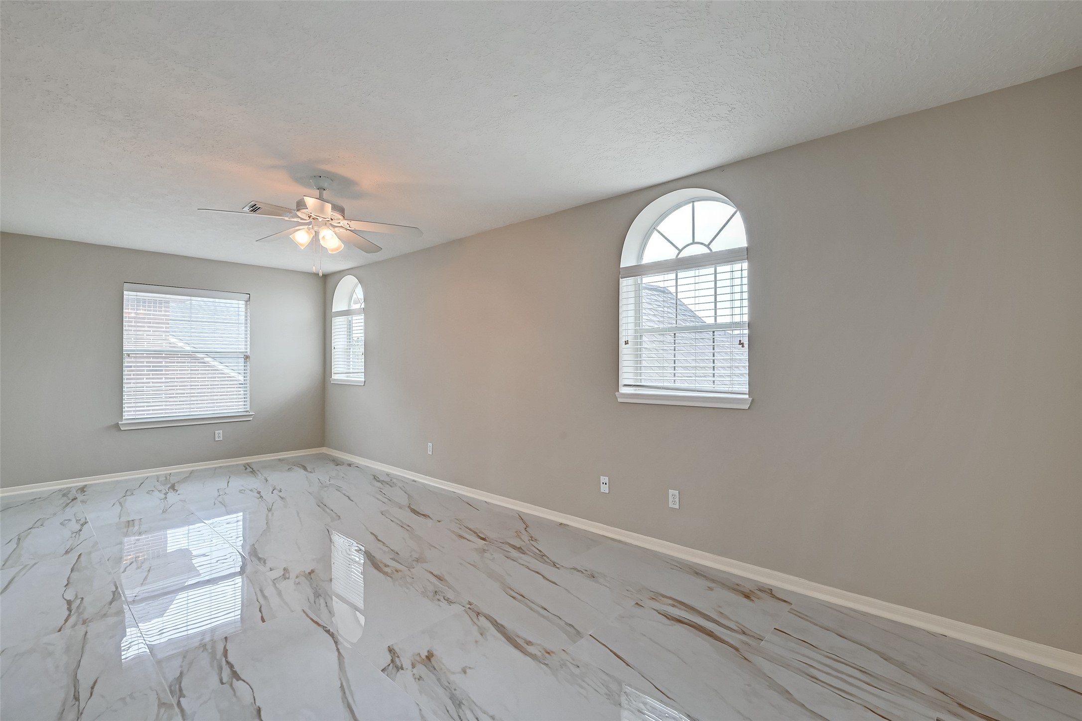 11954 Galentine Point Cypress, TX 77429 - Photo 25 of 48 an empty room with windows and fan