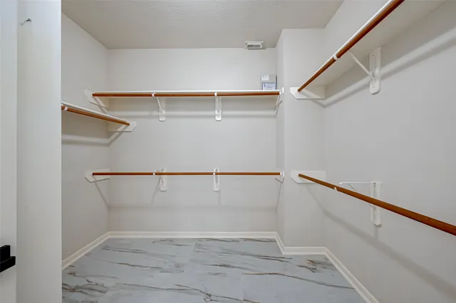 a view of an empty walk in closet