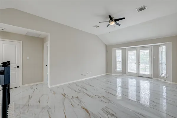 a view of an empty room with a window