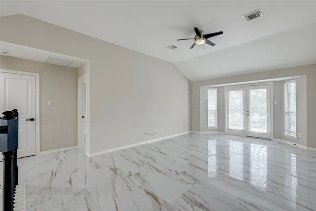 a view of an empty room with a window