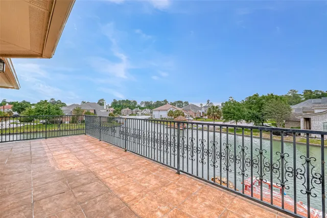 a view of balcony with yard