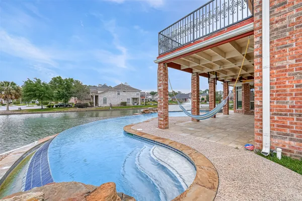 a view of swimming pool with a patio