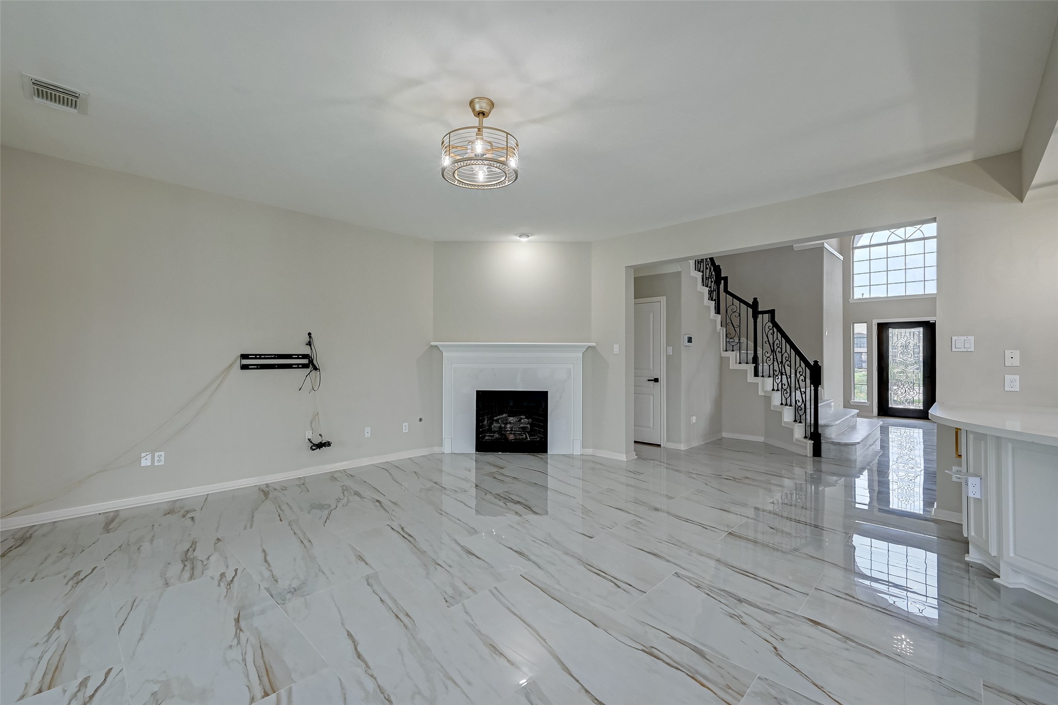 11954 Galentine Point Cypress, TX 77429 - Photo 8 of 48 a view of an empty room with wooden floor and a window