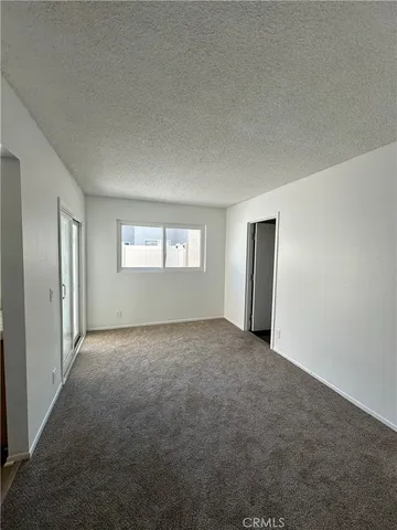 a kitchen with a refrigerator and a stove