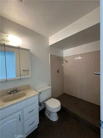 a bathroom with a sink a toilet and a bathtub