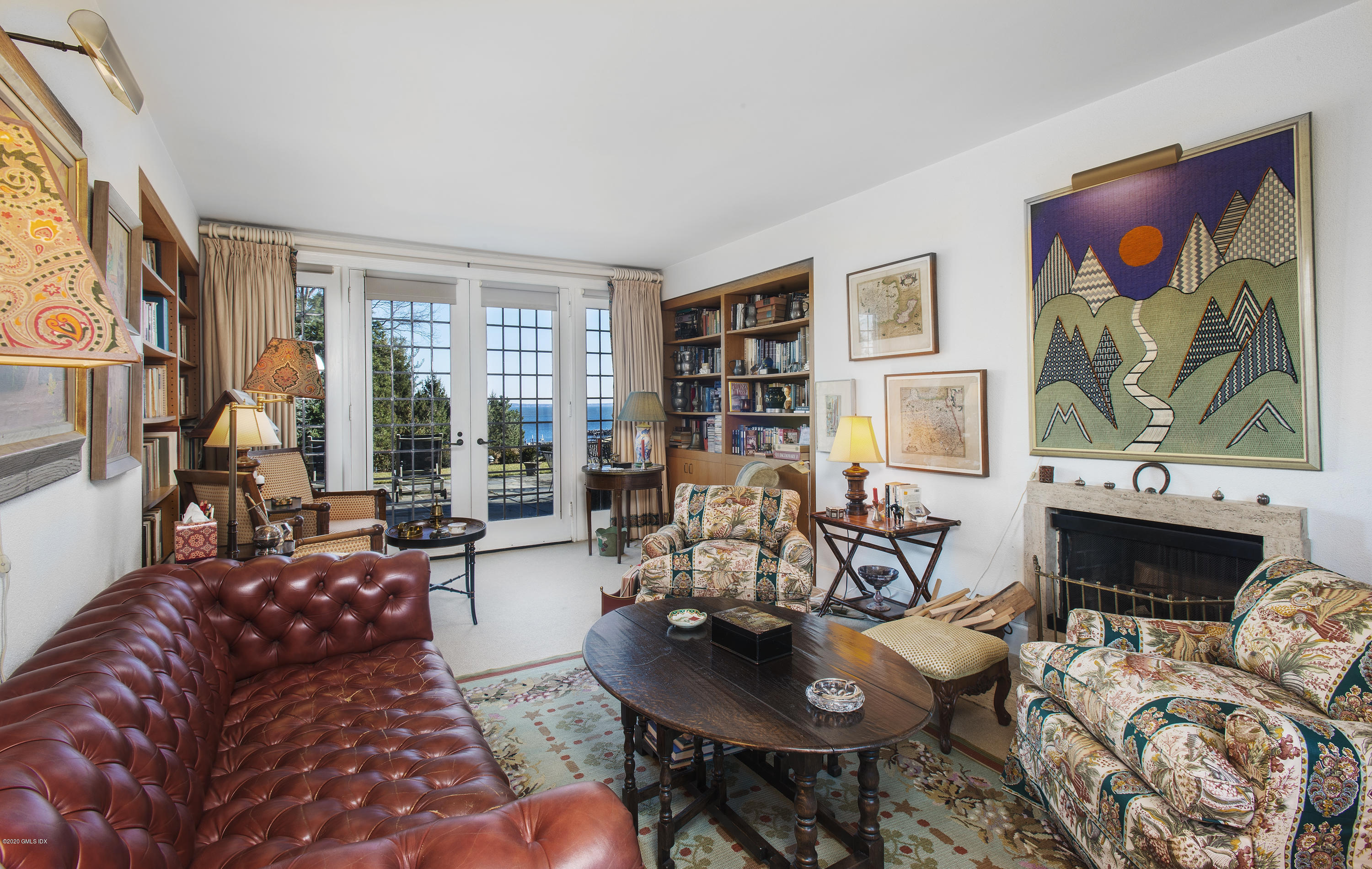 140 Field Point Circle Greenwich, CT 06830 - Photo 16 of 19 a living room with furniture and a floor to ceiling window