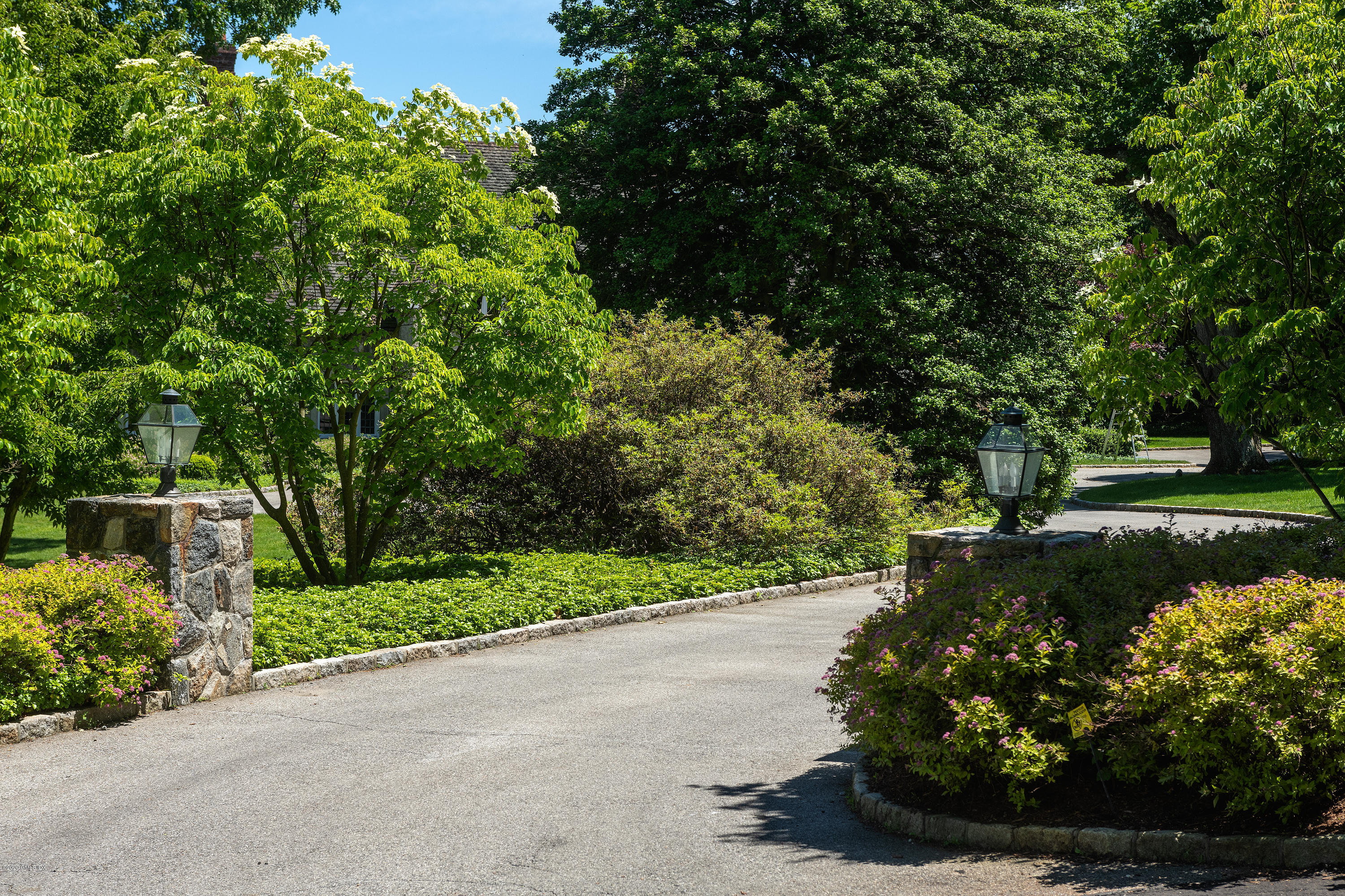 140 Field Point Circle Greenwich, CT 06830 - Photo 3 of 19 a view of a garden with a pathway