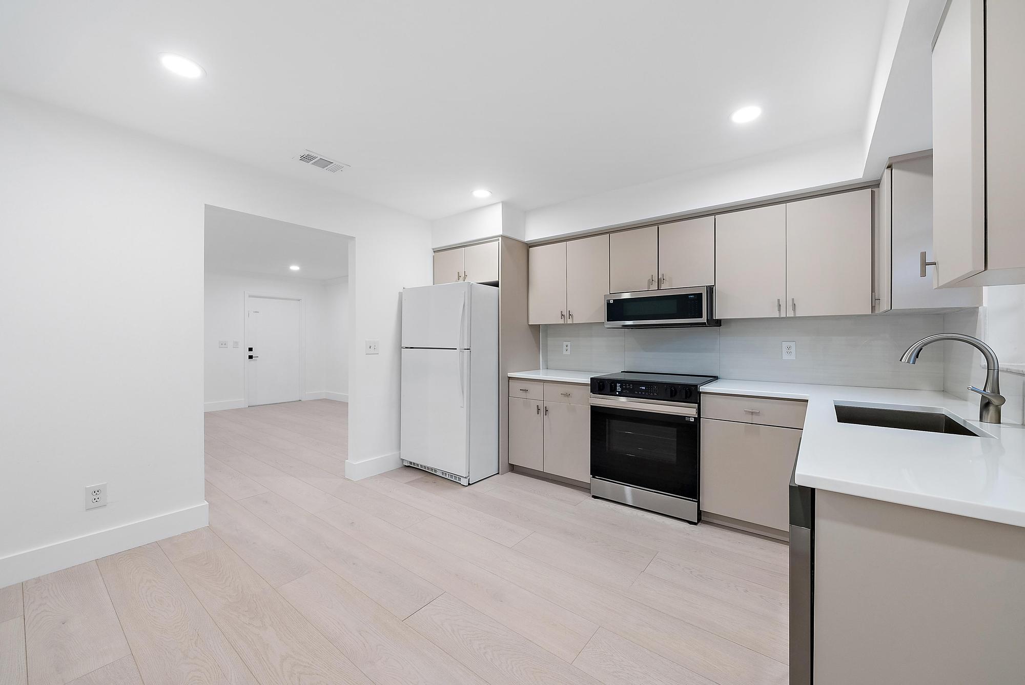 1930 Service Road North Palm Beach, FL 33408 - Photo 5 of 15 Kitchen from back door