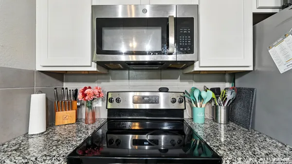 a kitchen with a stove and a microwave