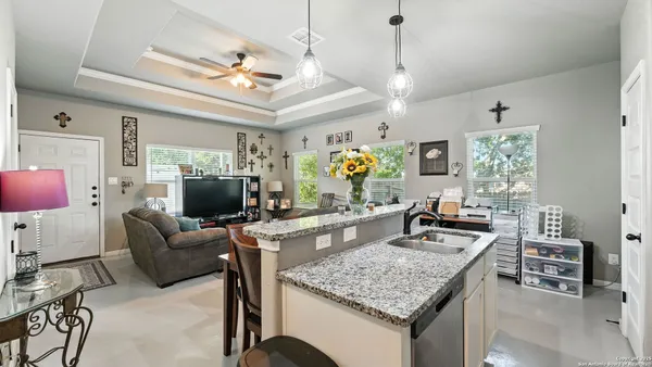 a living room with furniture and a table