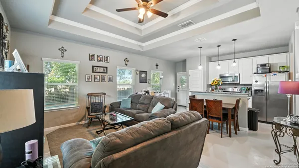 a living room with furniture and a fireplace