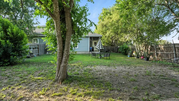 a backyard of a house with lots of green space