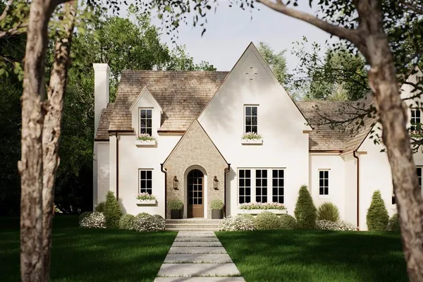 a view of a white house with a yard