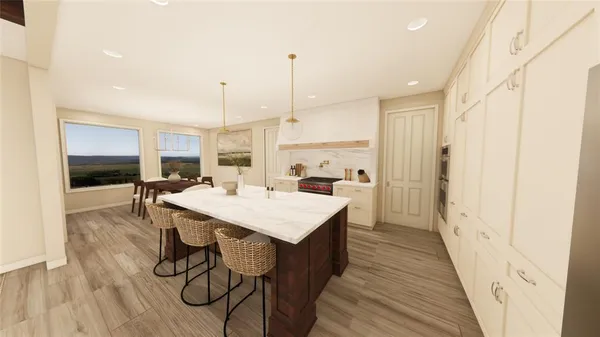 a large kitchen with a table and chairs