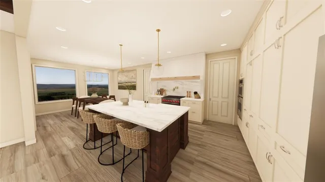 a large kitchen with a table and chairs