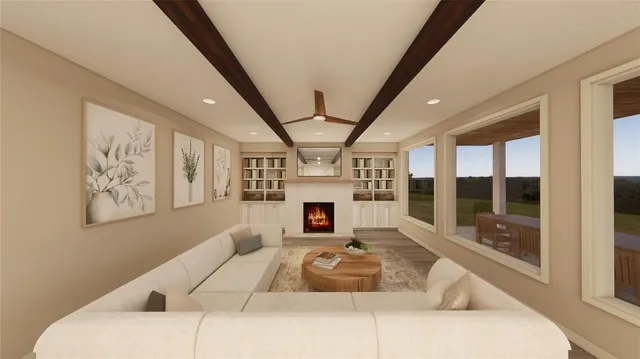 a living room with furniture large window and fireplace