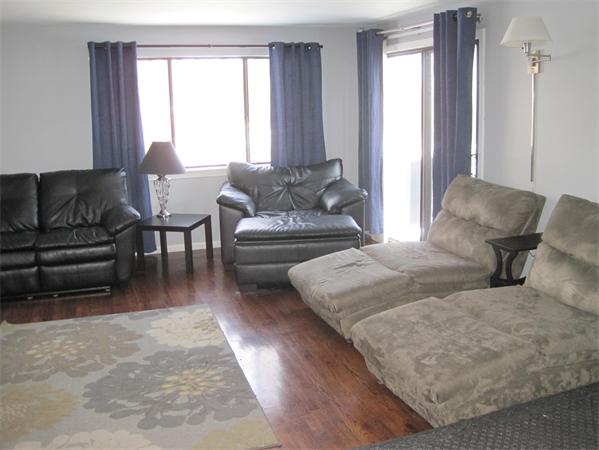 1 Mountain Gate Road, Unit 1 Ashland, MA 01721 - Photo 3 of 13 a living room with furniture and a large window