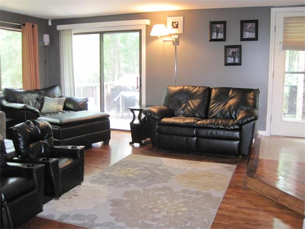 1 Mountain Gate Road, Unit 1 Ashland, MA 01721 - Photo 4 of 13 a living room with furniture and a flat screen tv