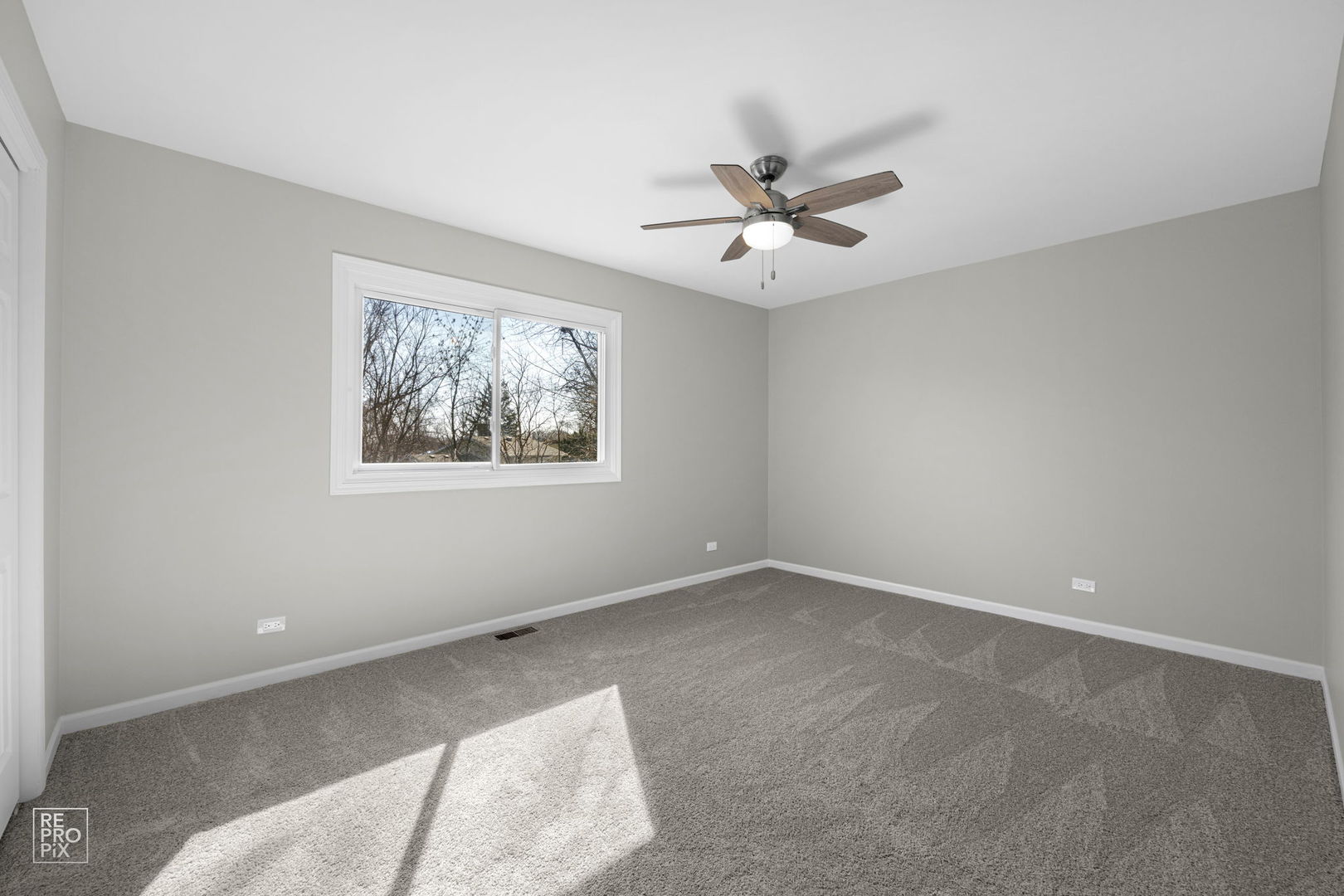 653 West Briarcliff Road Bolingbrook, IL 60440 - Photo 8 of 15 a view of an empty room with a window