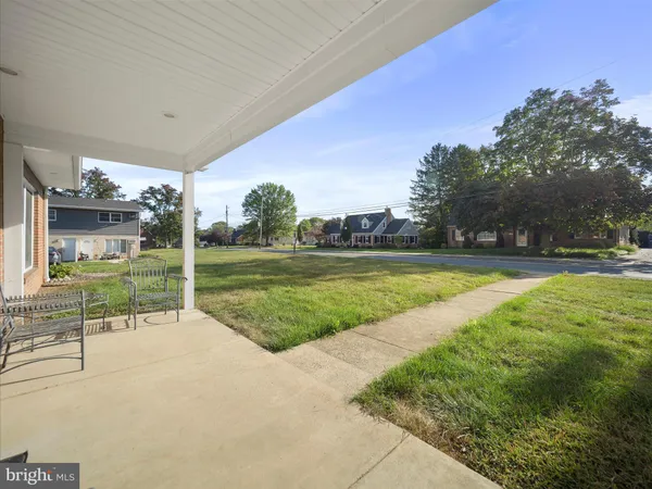 a view of a swimming pool with a yard