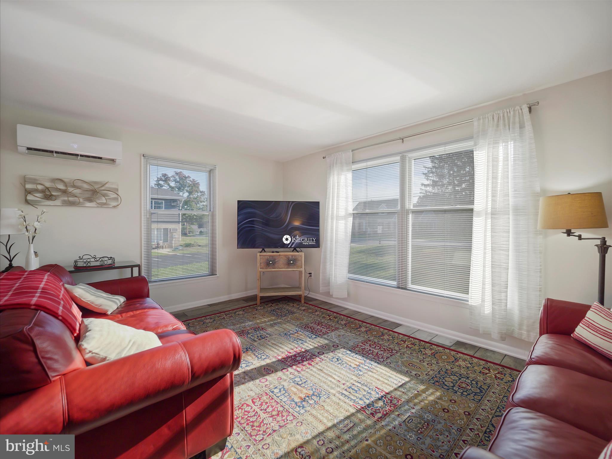 235 South Ridge Avenue, Unit B Greencastle, PA 17225 - Photo 14 of 29 a living room with furniture a flat screen tv and a window