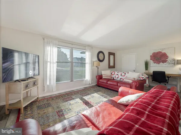 a bedroom with a bed and flat screen tv