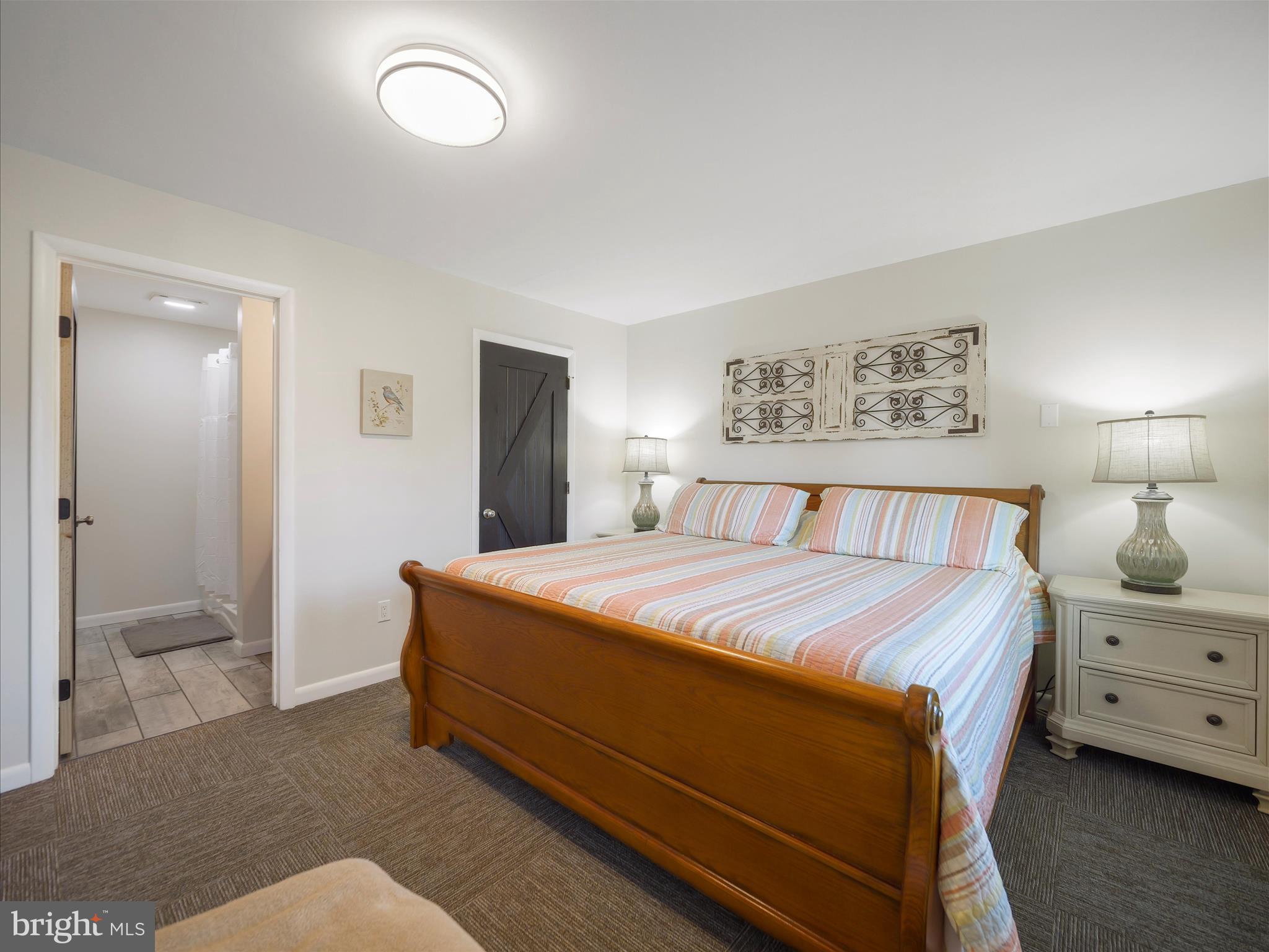 235 South Ridge Avenue, Unit B Greencastle, PA 17225 - Photo 21 of 29 a bedroom with a bed and a lamp