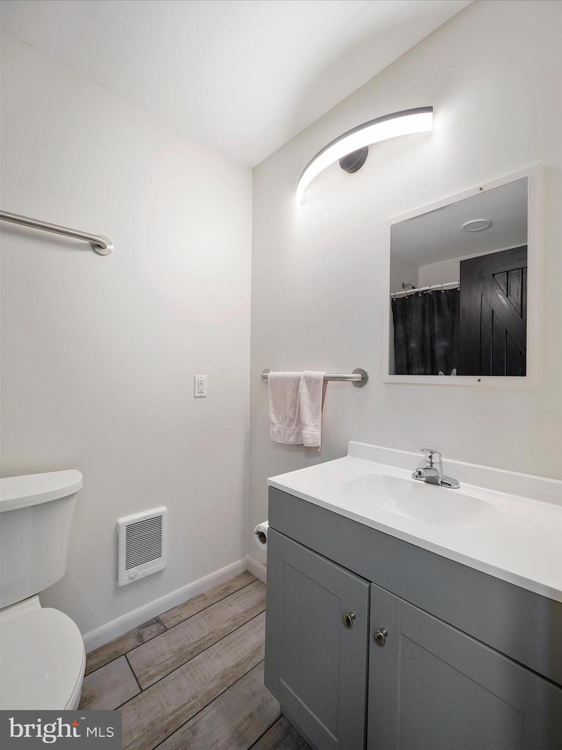 235 South Ridge Avenue, Unit B Greencastle, PA 17225 - Photo 26 of 29 a bathroom with a sink toilet and mirror