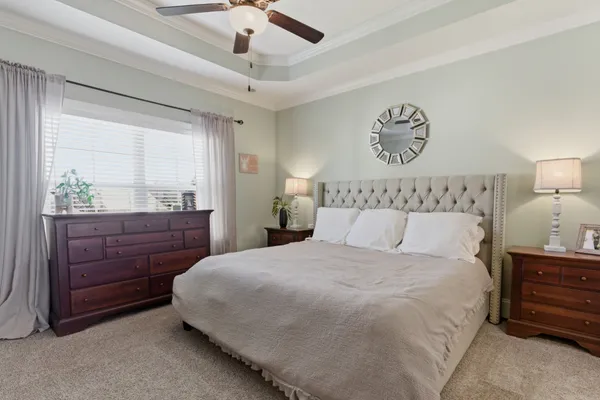 a bedroom with a bed and a dresser