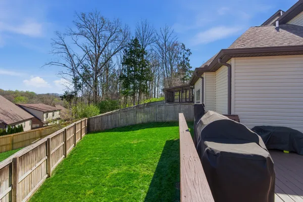 a view of a back yard of the house