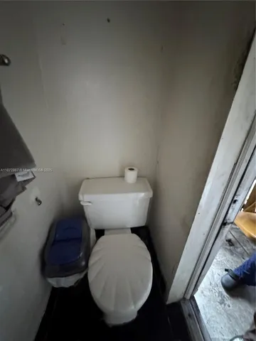 a bathroom with a sink toilet and a mirror