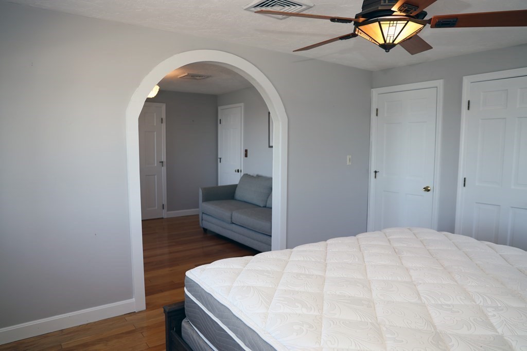 55 Rebecca Road Scituate, MA 02066 - Photo 11 of 27 a bedroom with a bed and a potted plant