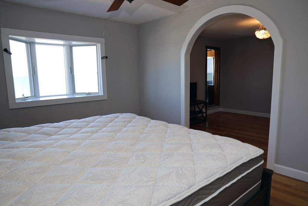 55 Rebecca Road Scituate, MA 02066 - Photo 13 of 27 a room with a bed and a mirror