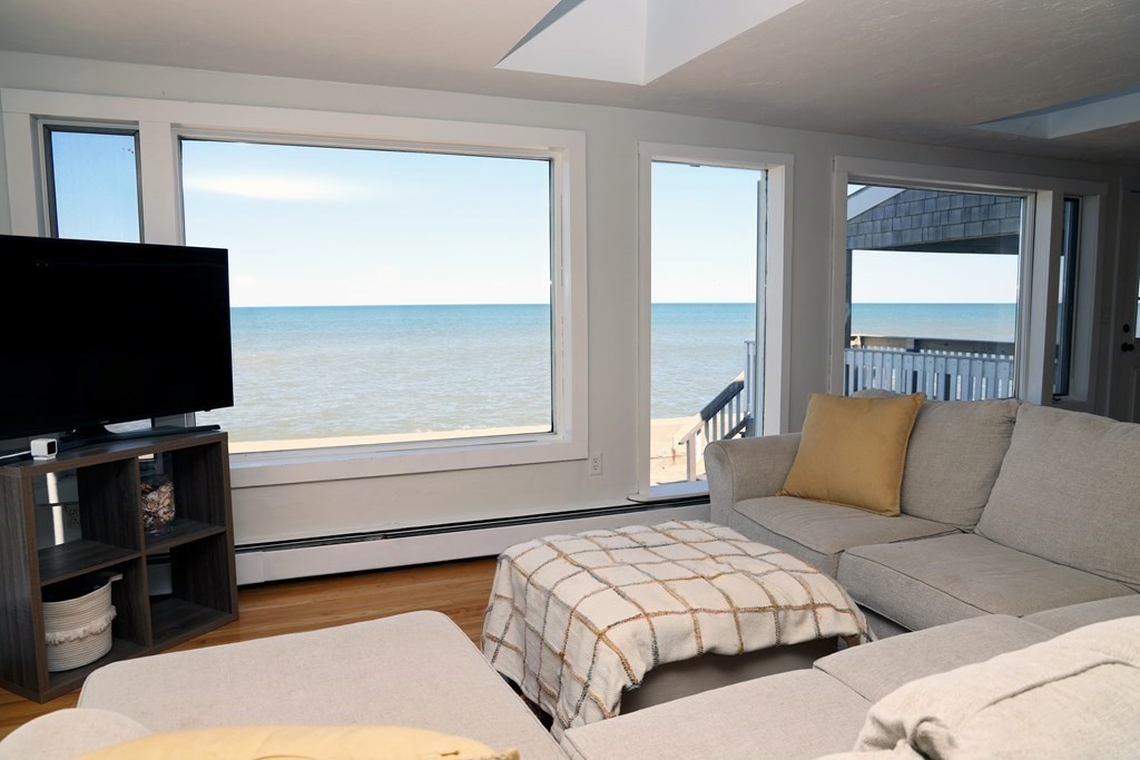 55 Rebecca Road Scituate, MA 02066 - Photo 2 of 27 a bedroom with a bed and a flat screen television