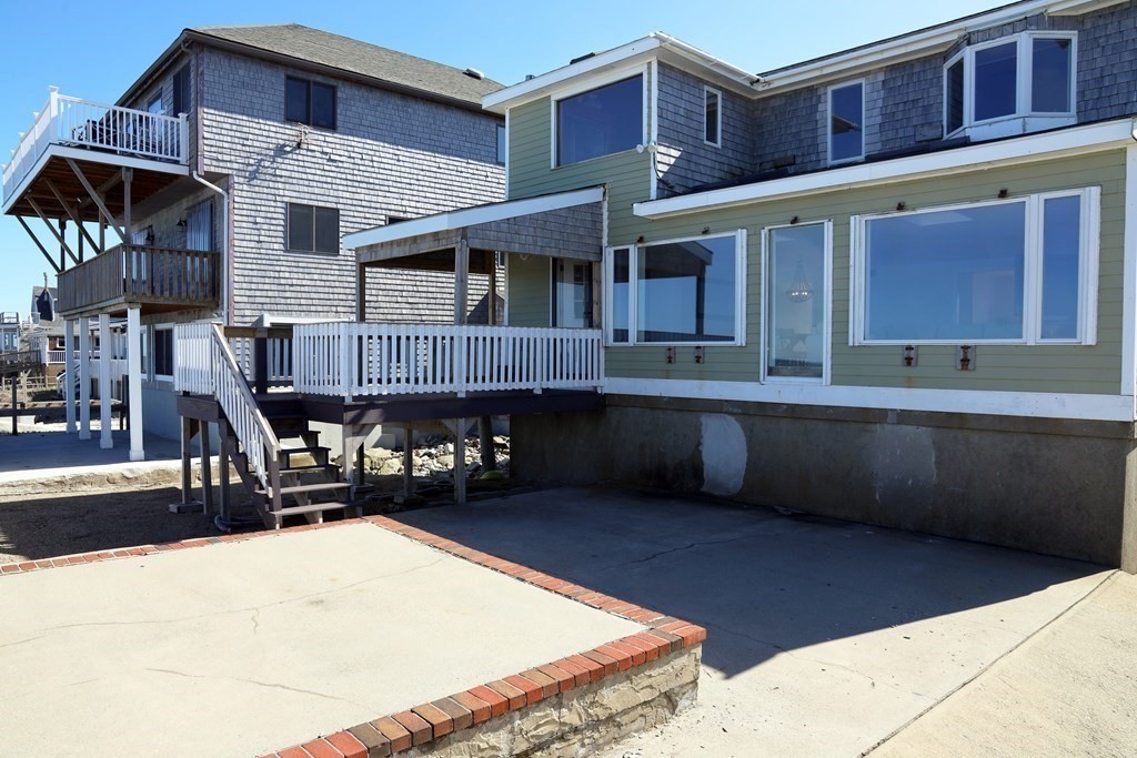 55 Rebecca Road Scituate, MA 02066 - Photo 26 of 27 a front view of a building with sitting area