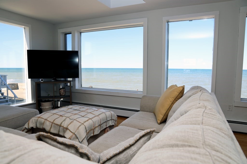 55 Rebecca Road Scituate, MA 02066 - Photo 3 of 27 a bedroom with a bed and a flat screen tv