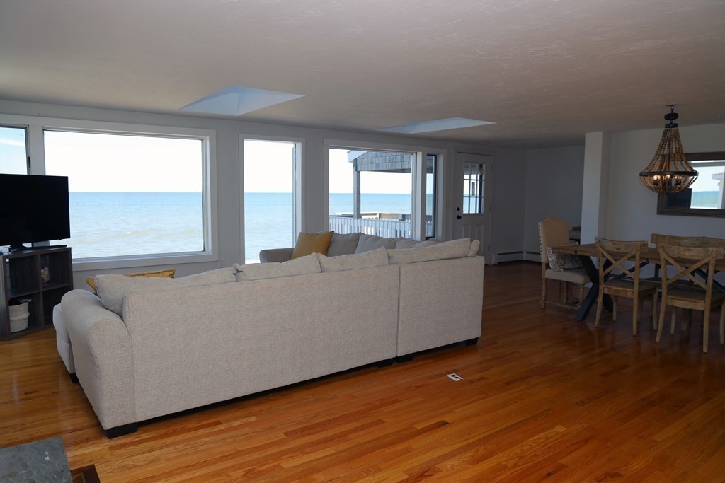 55 Rebecca Road Scituate, MA 02066 - Photo 4 of 27 a living room with furniture and a flat screen tv