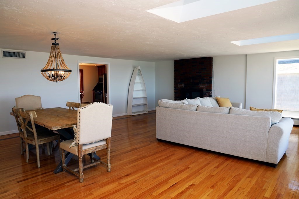 55 Rebecca Road Scituate, MA 02066 - Photo 7 of 27 a living room with furniture and wooden floor