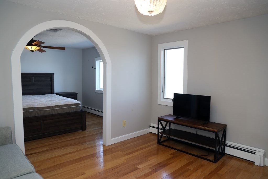 55 Rebecca Road Scituate, MA 02066 - Photo 9 of 27 a living room with furniture and a wooden floor
