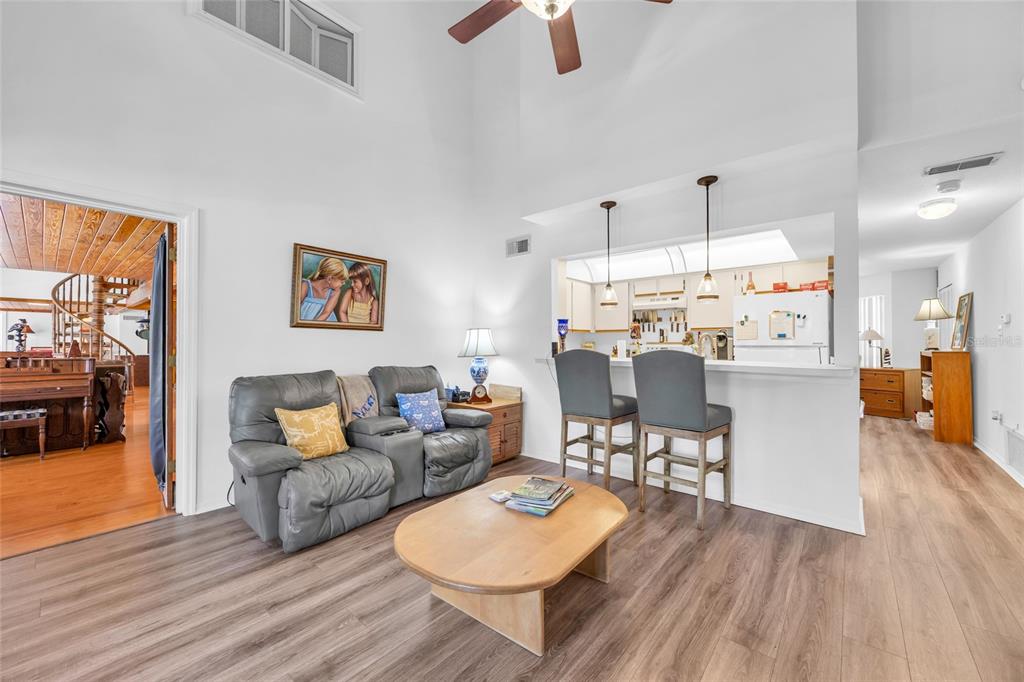 1217 Edgewood Ranch Road Orlando, FL 32835 - Photo 26 of 91 a living room with furniture and a wooden floor