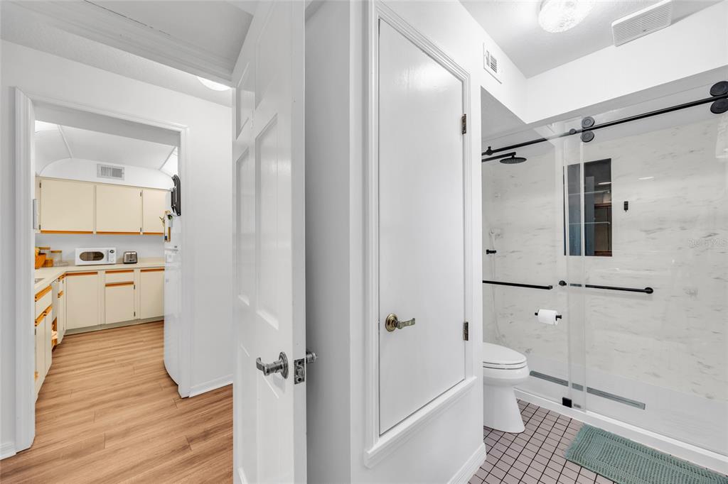 1217 Edgewood Ranch Road Orlando, FL 32835 - Photo 32 of 91 a bathroom with a toilet sink and shower