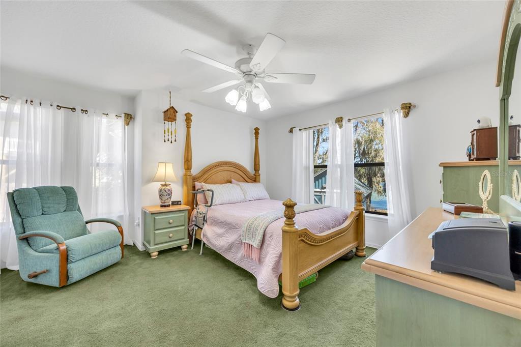 1217 Edgewood Ranch Road Orlando, FL 32835 - Photo 36 of 91 a bedroom with bed and a couch
